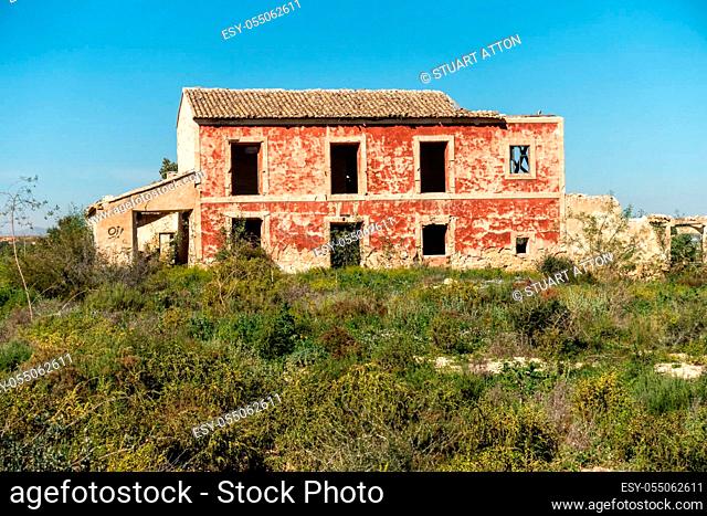 Old derelict house in Spain amidst fields and orange groves