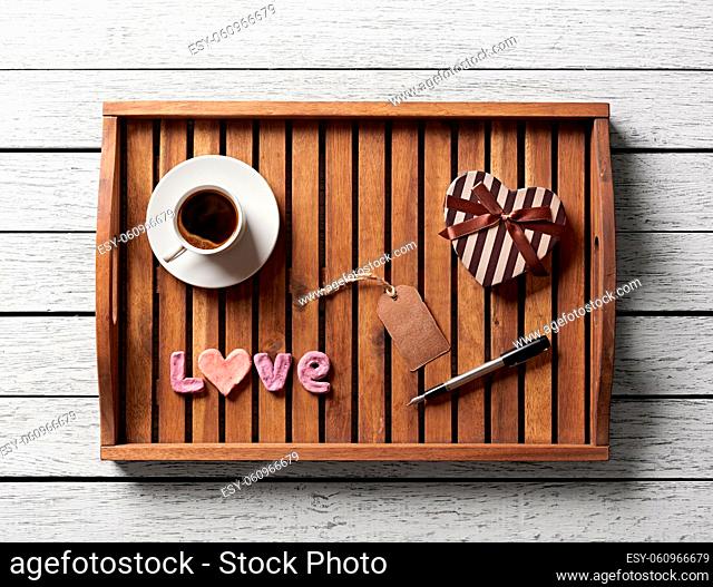 Valentine salver served with cup of coffee, gift box, word love and gift tag