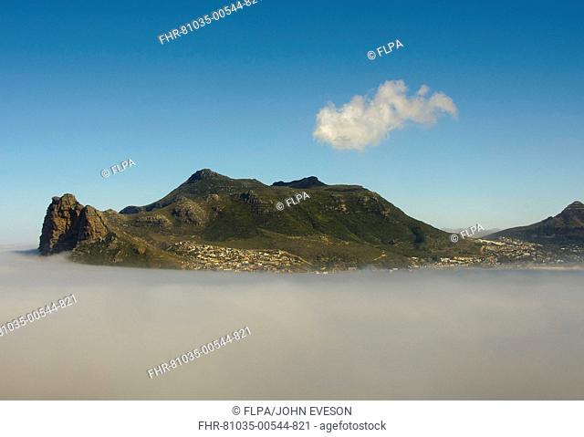 View of mist shrouded coastal mountain, The Sentinel, Hout Bay, Cape Town, Western Cape, South Africa