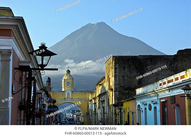 Agua Volcano, stratovolcano looming above town, Santa Catalina arch, La Antigua, Guatemalan Highlands, Guatemala