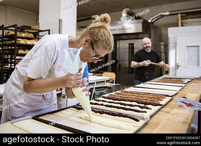Baker Jan Hanzl (back) prepares Apple pies (strudels) in his bakery in Vimperk, Czech Republic, January 19, 2023. (CTK Photo/Vaclav Pancer)