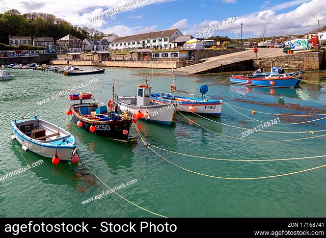 PORTHLEVEN, CORNWALL, UK - MAY 11 : View of the town and harbour in Porthleven, Cornwall on May 11, 2021. Unidentified people