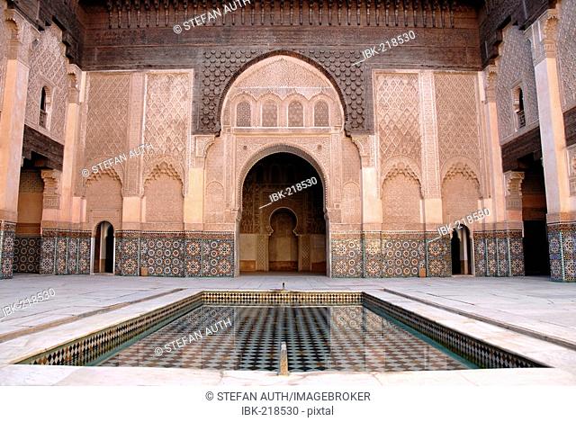Oriental designed harmonic yard with water pond Medersa Ali Ben Youssef medina Marrakech Morocco