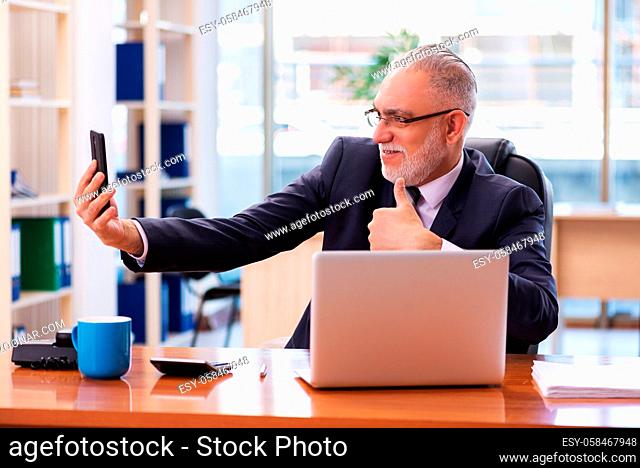 Senior businessman employee working in the office