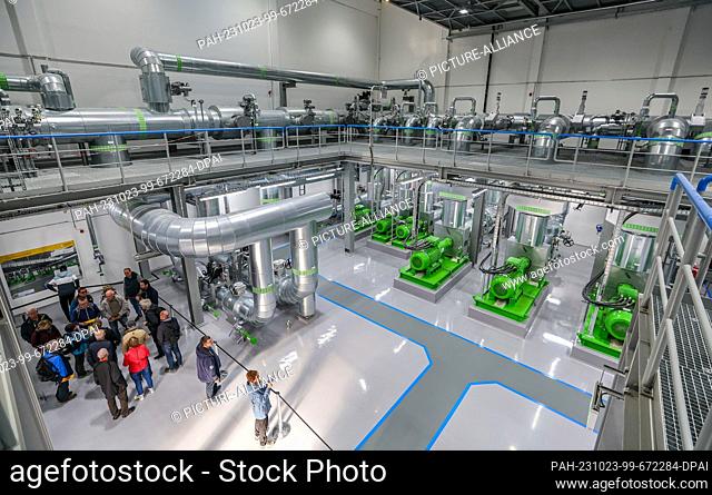 23 October 2023, Saxony, Leipzig: Visitors tour the pump hall for district heating at the new combined heat and power plant South