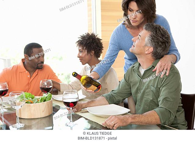Friends having wine together at dinner