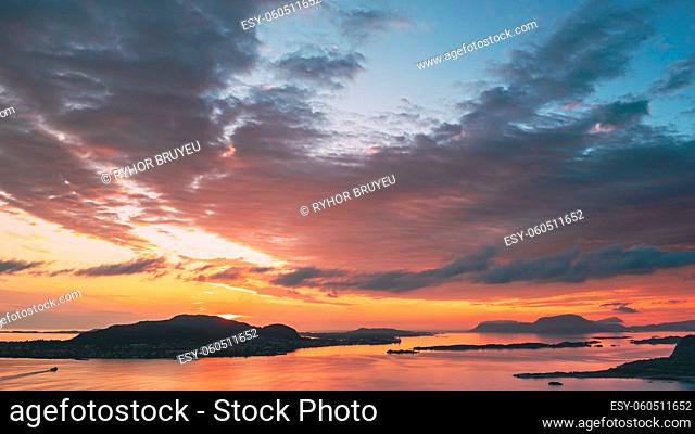 Alesund, Norway. Amazing Natural Bright Dramatic Sky In Warm Colours Above Alesund Valderoya And Islands In Sunset Time. Colorful Sky Background