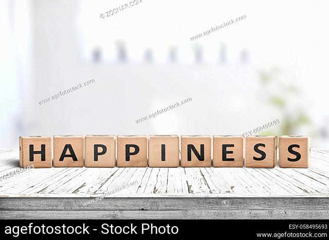 Happiness sign made of wood in a bright living room in the spring