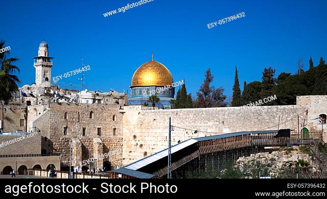 jerusalm western wall and goldem mosque blue sky