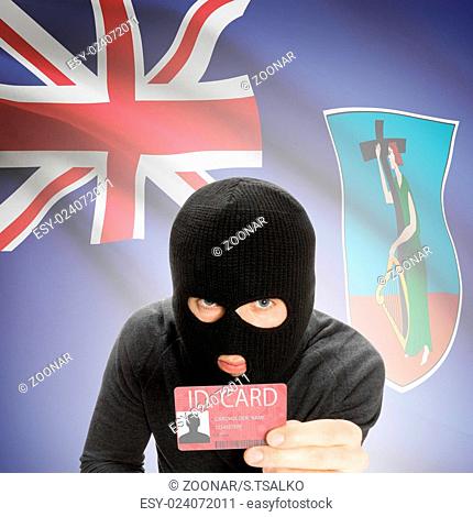Hacker with flag on background holding ID card in hand - Montserrat