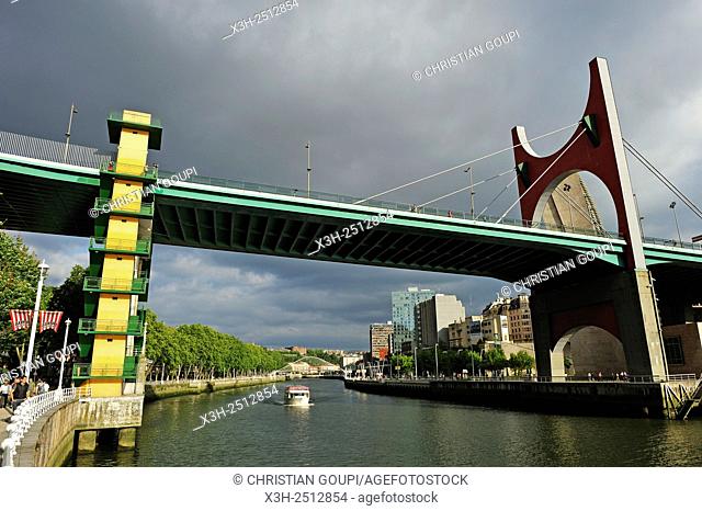 ''L'arc rouge'' The Red Arch by the French artist Daniel Buren on La Salve Bridge official name ''the Prince and Princess of Spain Bridge'' beside the...