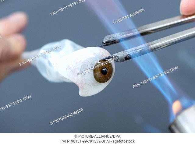 22 January 2019, Bavaria, München: Barbara Zimmermann, ocularist at the Institute for Artificial Eyes, forms an artificial eye out of glass
