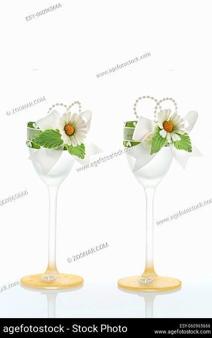 Wedding champagne glasses decorated with lace and flowers