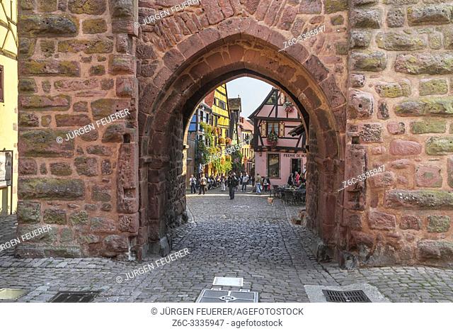 view through town gate to old village, Riquewihr, Alsace, France, historical timber architecture