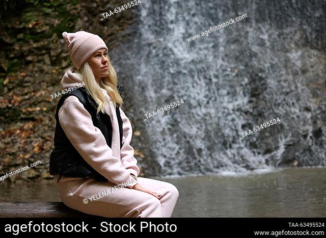 RUSSIA, GROZNY - OCTOBER 17, 2023: A tourist visits Nikhaloy Waterfalls in the Shatoy District. Yelena Afonina/TASS