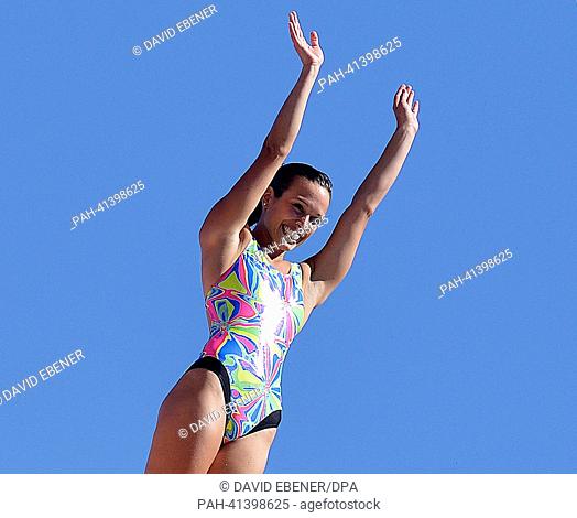 Bronze medalist Anna Bader of Germany waves to the spectators before a jump during the women's high diving final of the 15th FINA Swimming World Championships...