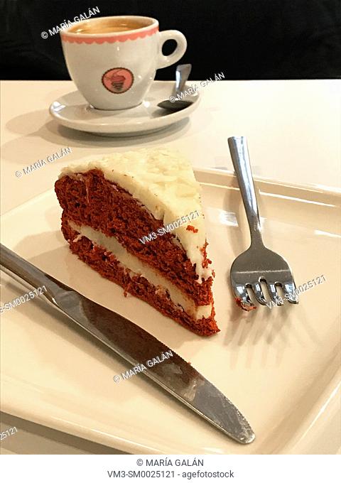 Piece of carrot cake and cup of coffee