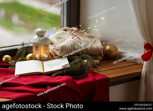 sketchbook, christmas lantern, sweater, fir branch