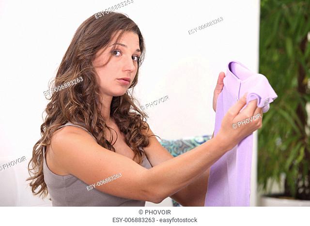 Woman unsure about a lilac top