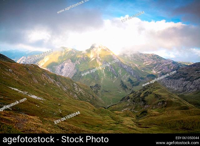 mountain ridge in clouds and sunshine, Austria