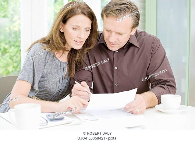 Husband and wife paying bills