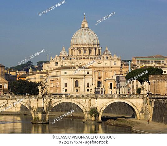 Rome, Italy. St Peter's Basilica. Tiber river and Sant'Angelo Bridge in foreground