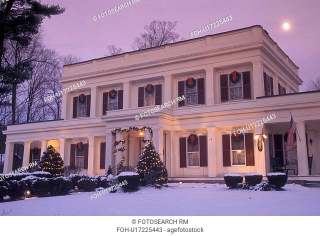 Inn, Vermont, winter, Christmas, Full moon rises over the Arlington Inn decorated for the holidays on a winter evening in Arlington in Bennington County in the...