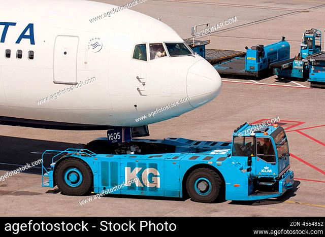 AMSTERDAM - MAY 11: Delta Boeing 737 is pulled by a special tow car at Schiphol airport on May 11, 2012, Amsterdam, The Netherlands