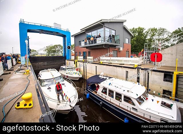 11 July 2022, Lower Saxony, Otterndorf: Boats moored in the Hadelner Canal lock. Currently the largest coastal protection project in Lower Saxony