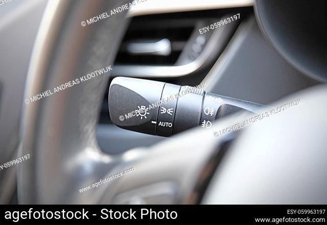 Switch off lights in a car - Close-up Car integrated turning indicator with headlight switch toggle