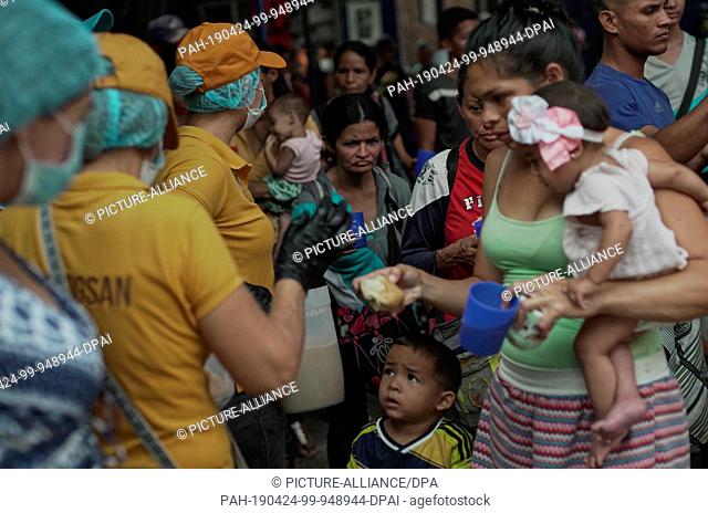 24 April 2019, Colombia, Cucuta: Women from Venezuela queue up with their children in the canteen of the ""Divina Providencia""