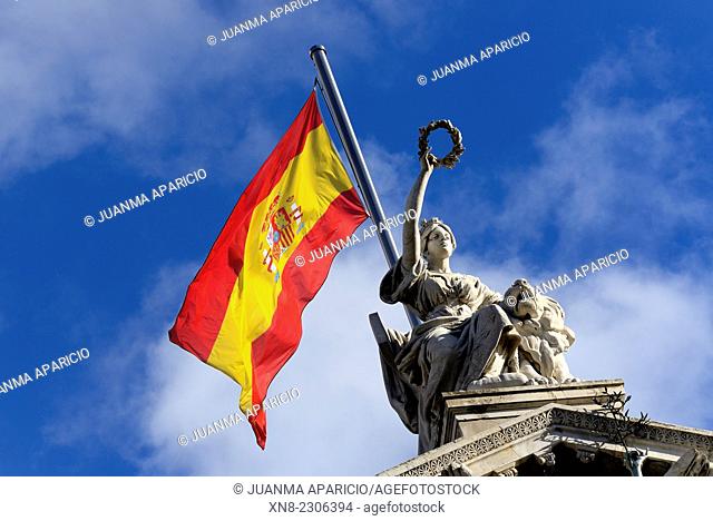 National flag and statue at the National Library, Biblioteca Nacional, also a museum, Museo del Libro, Paseo de Recoletos, Madrid, Spain, Europe