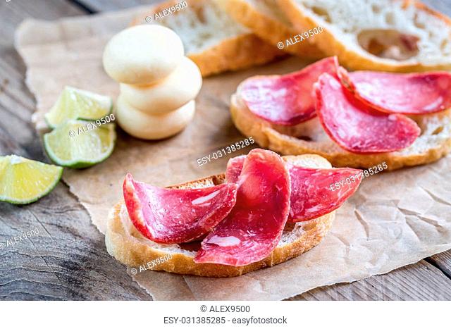 Ciabatta sandwiches with fuet and mini cheese