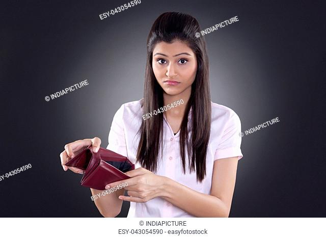 Portrait of businesswoman with empty wallet