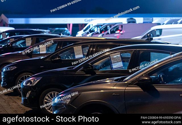 04 August 2023, Saxony-Anhalt, Wittenberg: New cars are parked on the premises of a Ford dealership in Wittenberg. The Federal Motor Transport Authority...