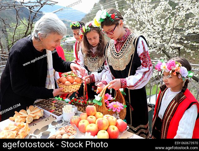 Gara Bov, Bulgaria- April 24, 2021: The girls decorate in a colorful and rich way their hairs and go around the village, singing songs and dancing