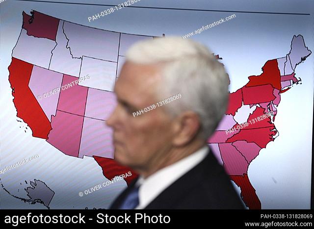 United States Vice President Mike Pence, listens during a press briefing with members of the coronavirus task force in the Brady Press Briefing Room of the...