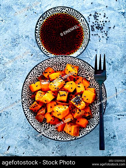 Pan-fried sweet potatoes with black sesame seeds and soy sauce