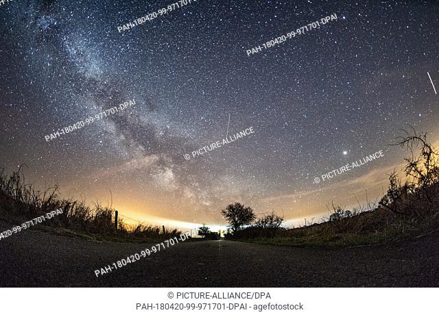 dpatop - 20 April 2018, Germany, Burg auf Fehmarn: The annual April Lyrids meteor showers illuminate the night sky and make airplanes