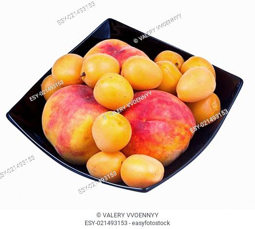 peaches and apricots in black plate
