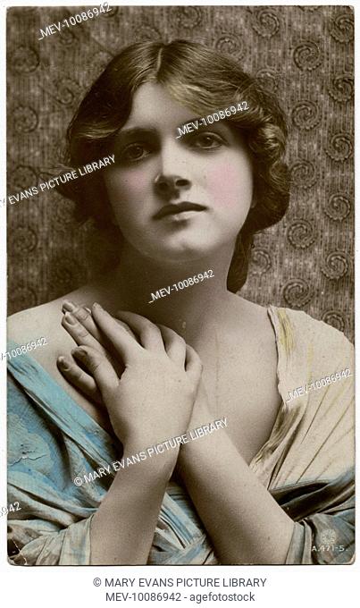 English actress of stage and screen, Gladys Cooper (1888-1971), with her hands clasped to her chest