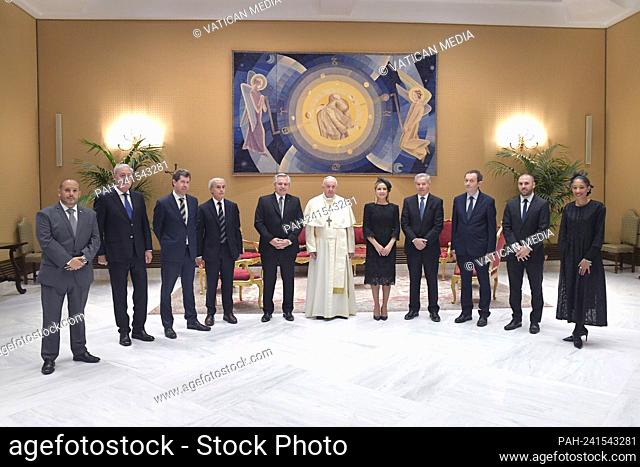 This photo taken and handout on May 13, 2021 by The Vatican Media shows Pope Francis (L) holding a private audience with Argentine President Alberto Fernandez...