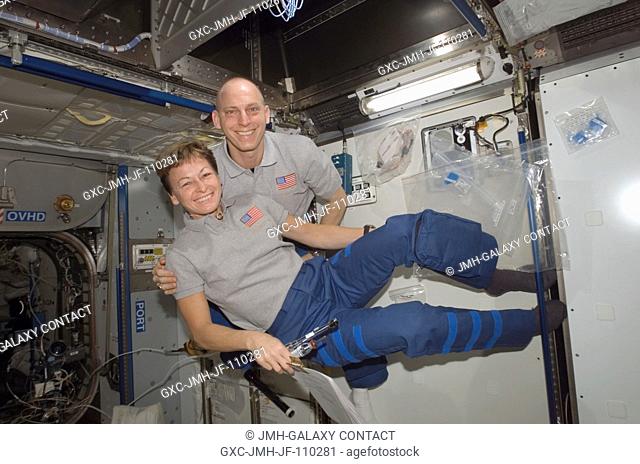 Astronauts Peggy Whitson, Expedition 16 commander, and Clay Anderson, STS-120 mission specialist, pose for a photo in the Harmony node of the International...