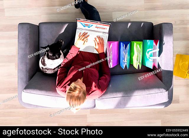Ecommerce Online Shopping On Sofa Using Laptop