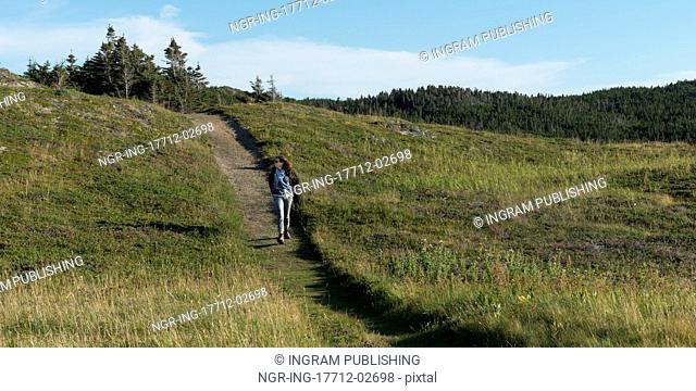 Hiker at Long Point Hiking Trail, Crow Head, Twillingate, North Twillingate Island, Newfoundland And Labrador, Canada