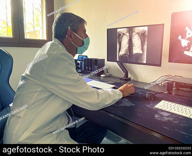 Worried doctor in the studio examining covid-19 case,