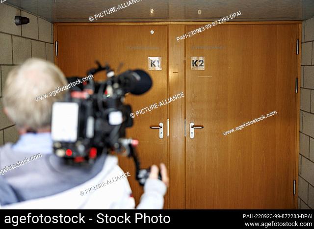 23 September 2022, Hamburg: A cameraman films the closed door behind which the NDR Broadcasting Council meets. Photo: Axel Heimken/dpa