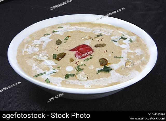 Traditional Indian Raita with raisins and cashew nuts and coriander
