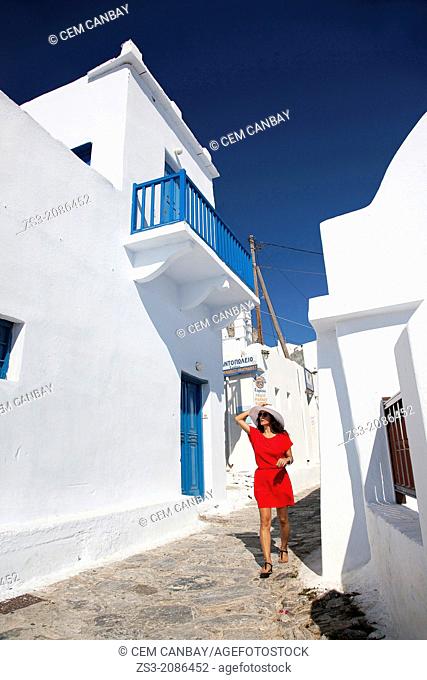 Woman having a walk in town center, Amorgos, Cyclades Islands, Greek Islands, Greece, Europe