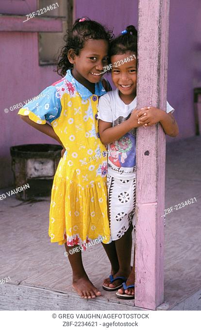 Marshall Islands, Micronesia: Two young Marshallese girls on porch of house in Uliga community of Majuro Atoll